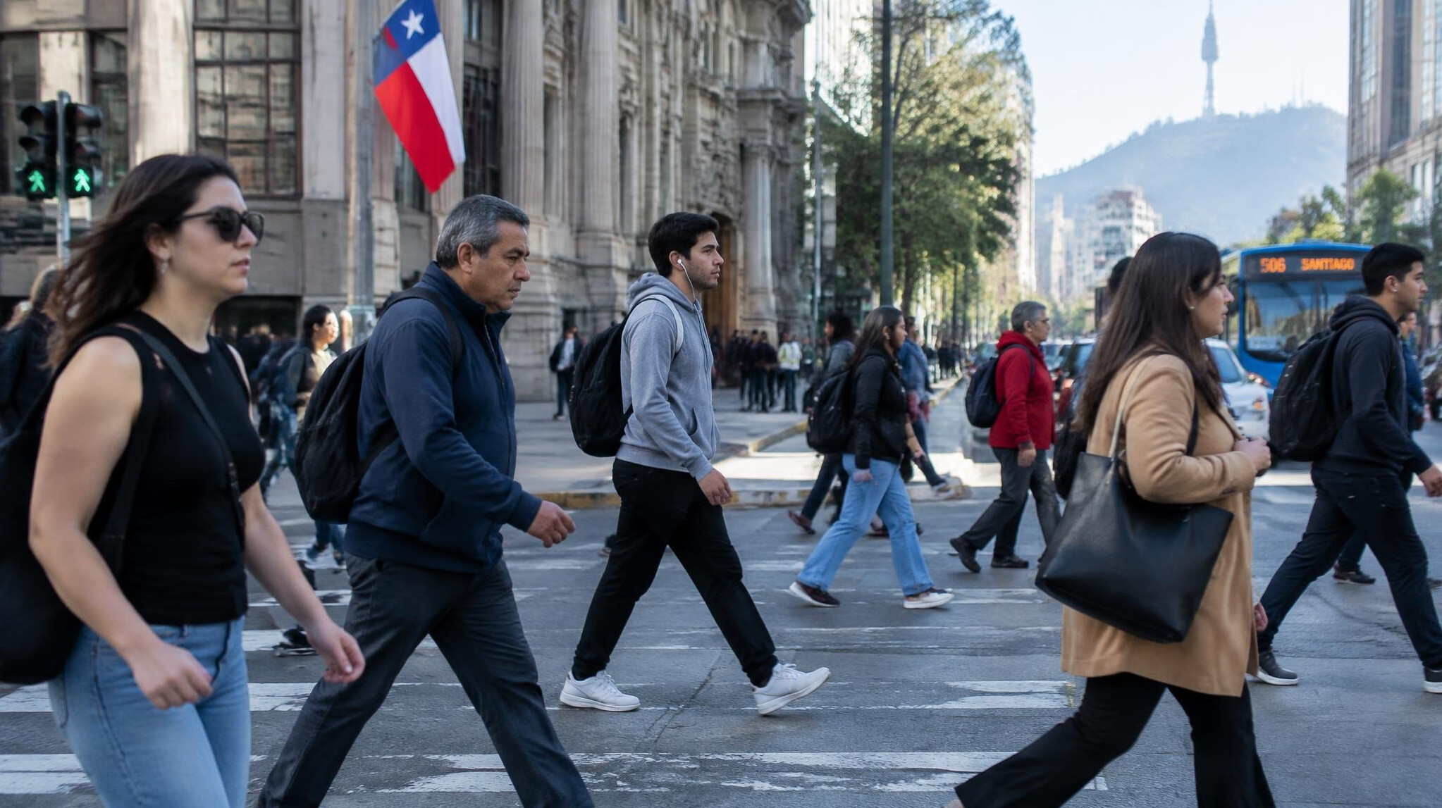 Pedestrians crossing a busy city street