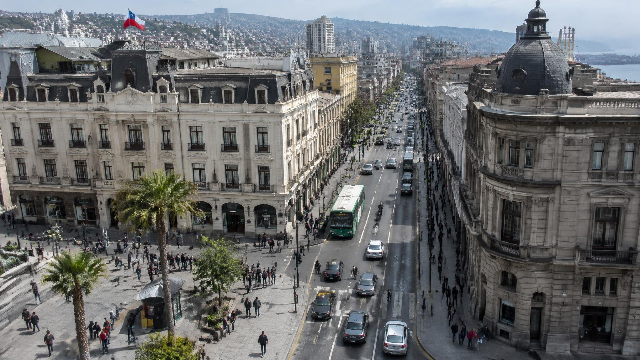 Aerial view of a busy city street with pedestrians