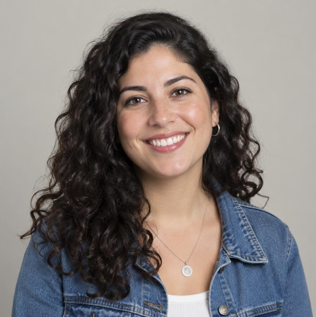 Portrait of a Latin American woman with curly hair smiling