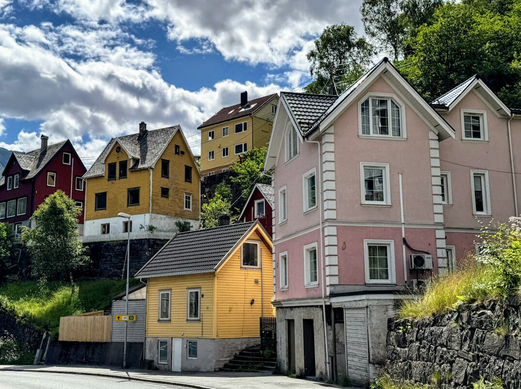Row of colorful houses along a hillside street